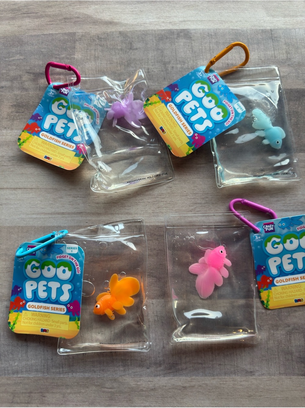 Goo Pets Goldfish Series Sensory Toys - Pink, Orange, Blue, Purple